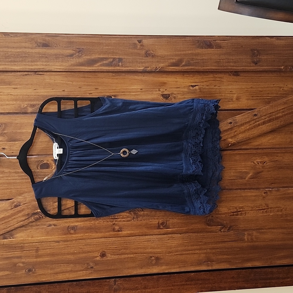 Beautiful navy tank top blouse. Has attached necklace that can be taken off.